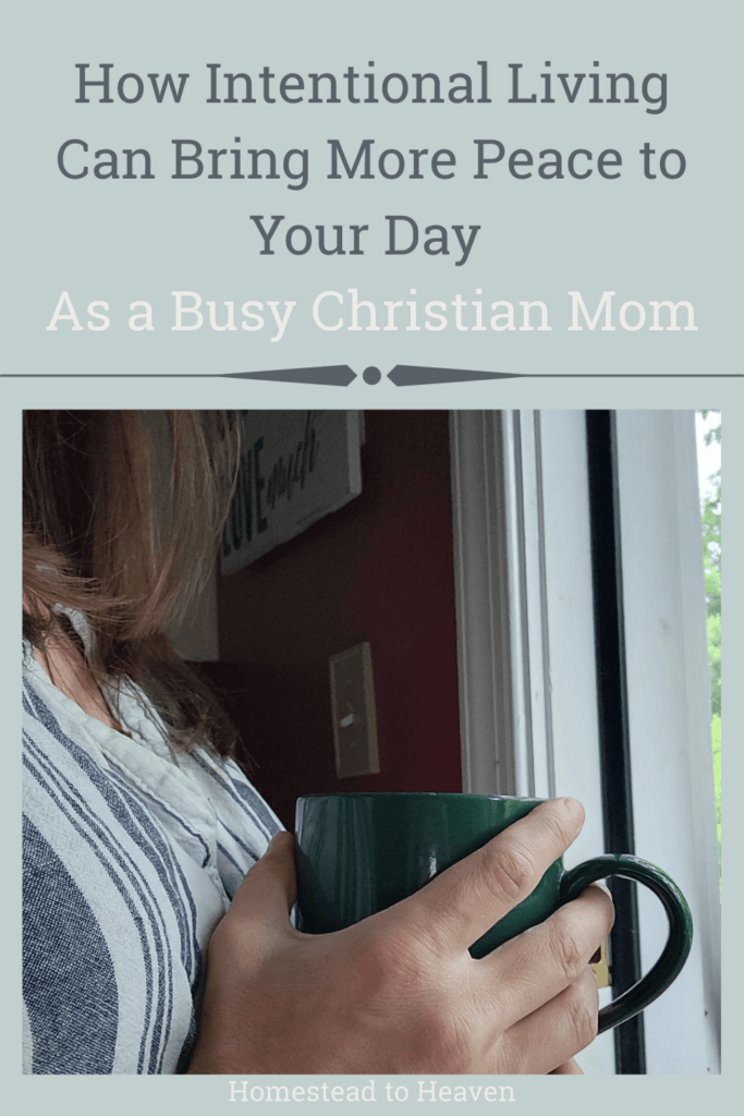 christian mom's hands folded around coffee mug as she contemplates intentional living