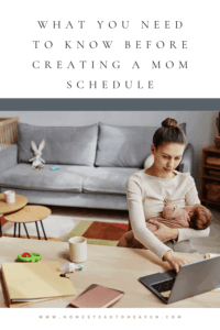 mom holding baby sitting at computer